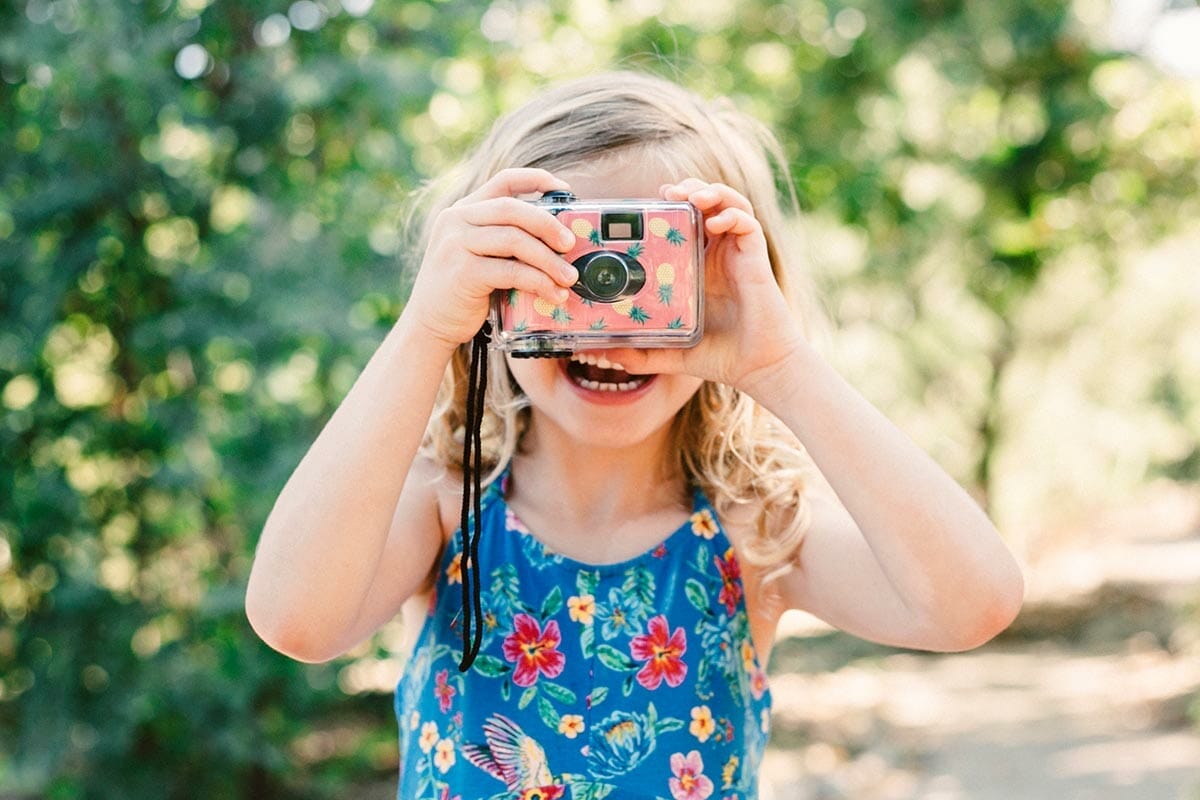 A,Little,Girl,With,Blonde,Curly,Hair,Take,A,Picture